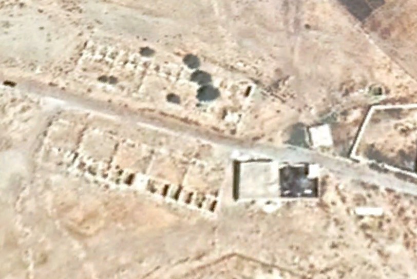 Satelite photo of the Qasr. Note how the road goes right through the middle of the ruins. The modern mosque is on the right.