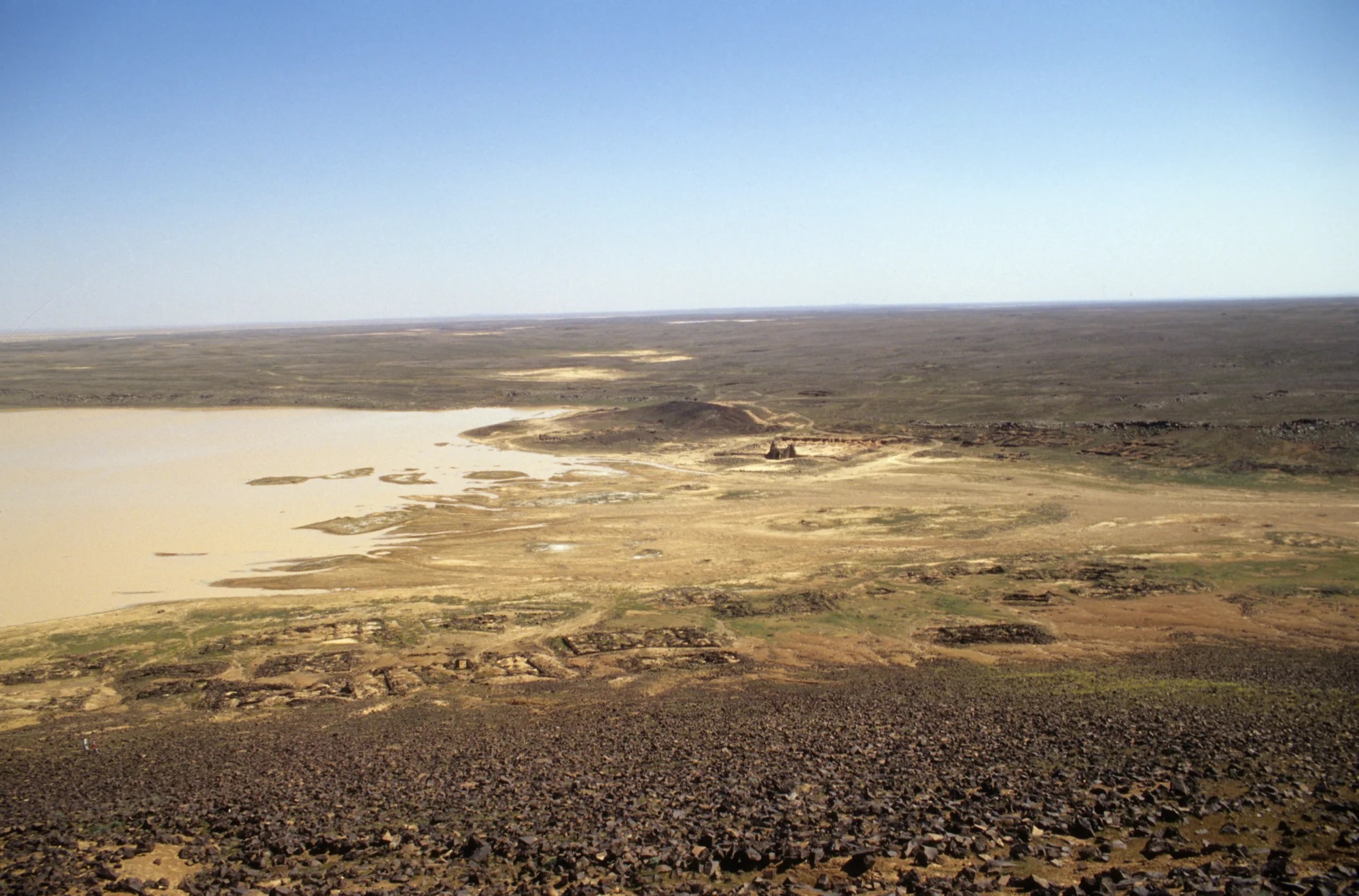 View from the volcano rim. Walid’s Qasr can be seen in the distance across the delta. 