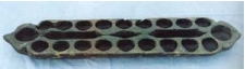 A traditional Mancala board found in Asia. They can be anywhere from 2 x 8 to 2 x 12, and usually have a bin on either end.