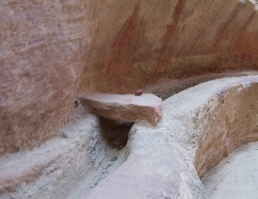 Along the left hand side of the siq, a covered water channel used to bring water from the spring in Wadi Musa into the center of Petra.