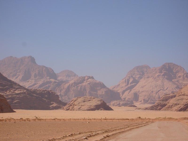 Down in the flat desert. It is through these mountains that the railway takes the plunge through Battan al Ghul down to the desert below.